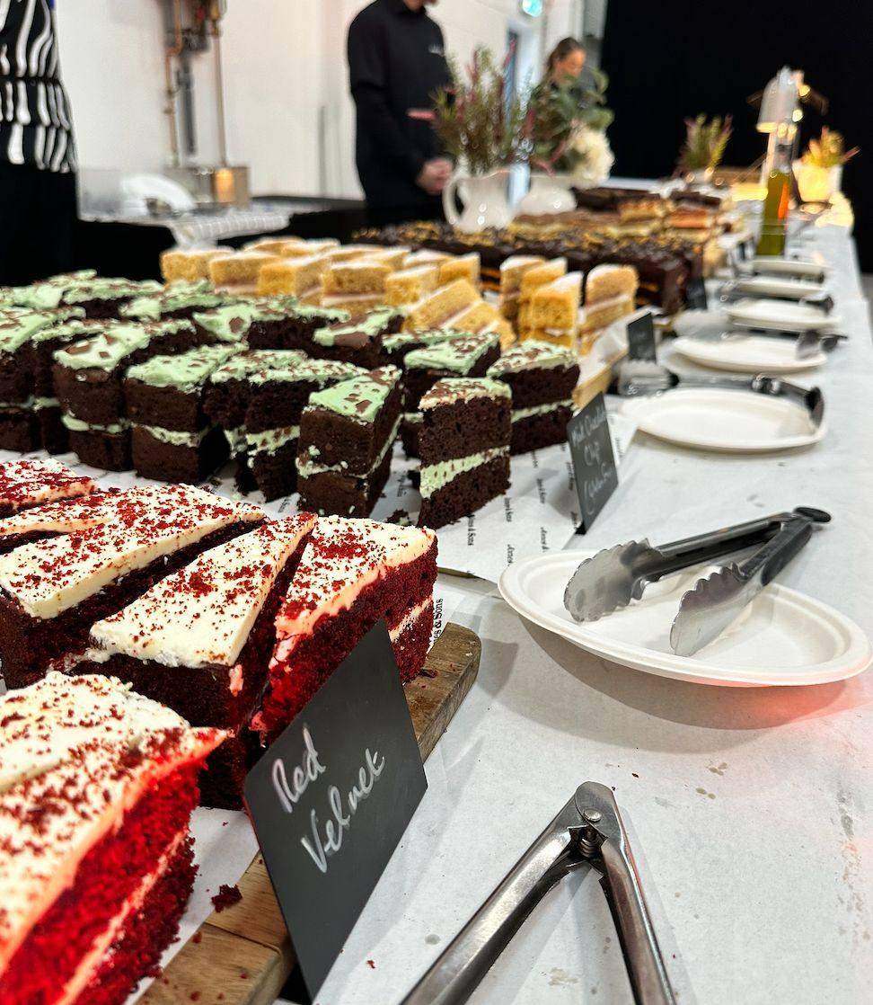 Dessert table with red velvet, mint chocolate and lemon traybakes