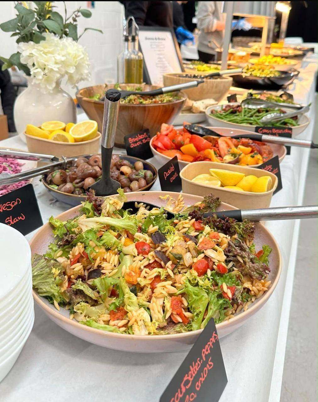 Location buffet with fresh salads, lemons and hot dishes